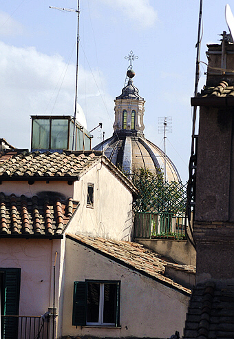 Church of Santa Agnese emerging from old Rome roofs
