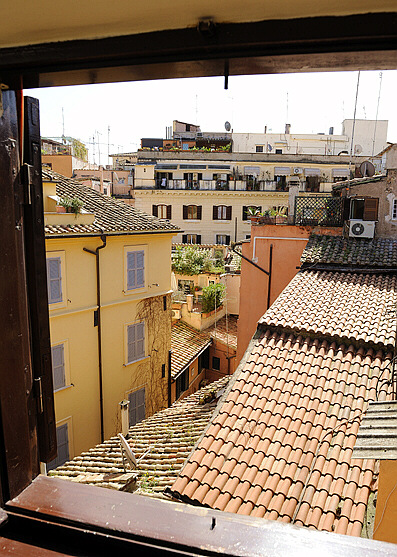 Roman Roofs penthouse bedroom window view